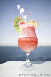 tropical-drink-with-umbrella-and-fruit-garnish-~-200169699-001