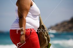 ist2_2592411_fat_woman_at_the_beach